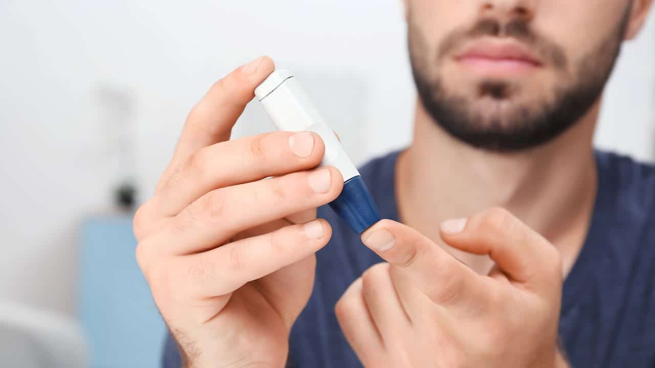 Man with diabetes checking his insulin levels